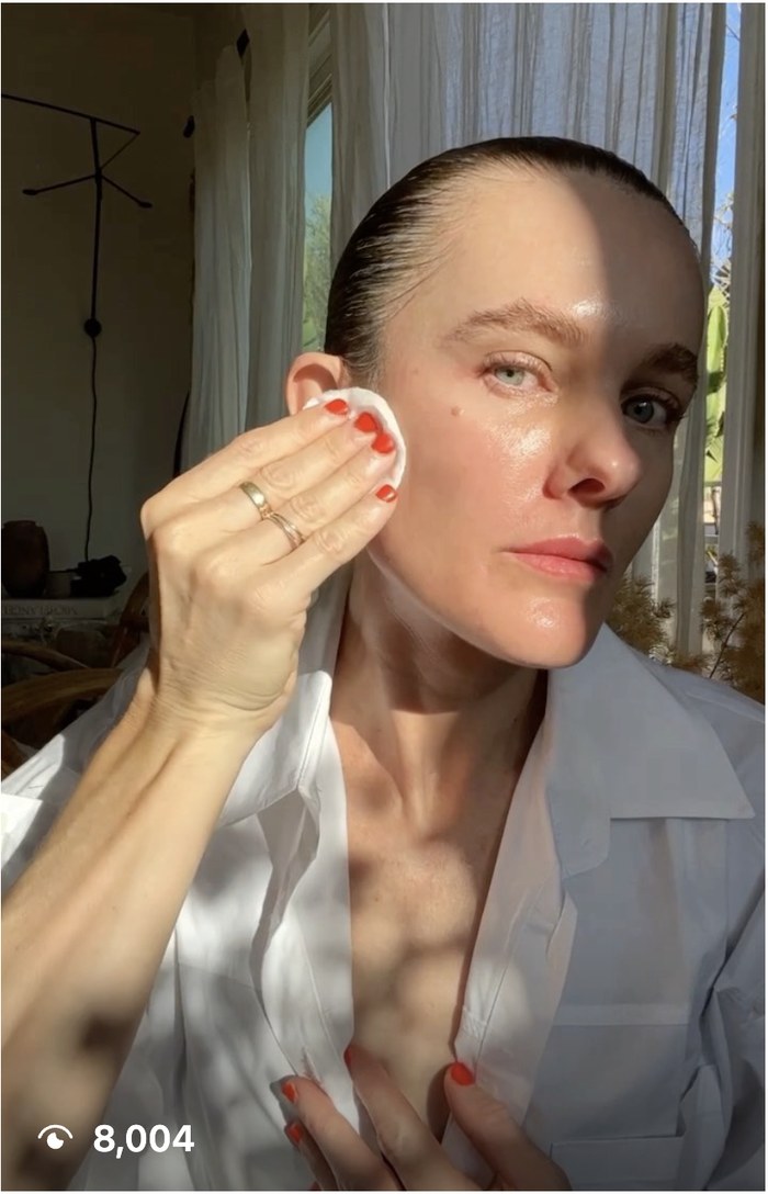 Creator applying Eighth Day Resurfacing Tonic with a cotton pad, Instagram Reel with 8,004 views