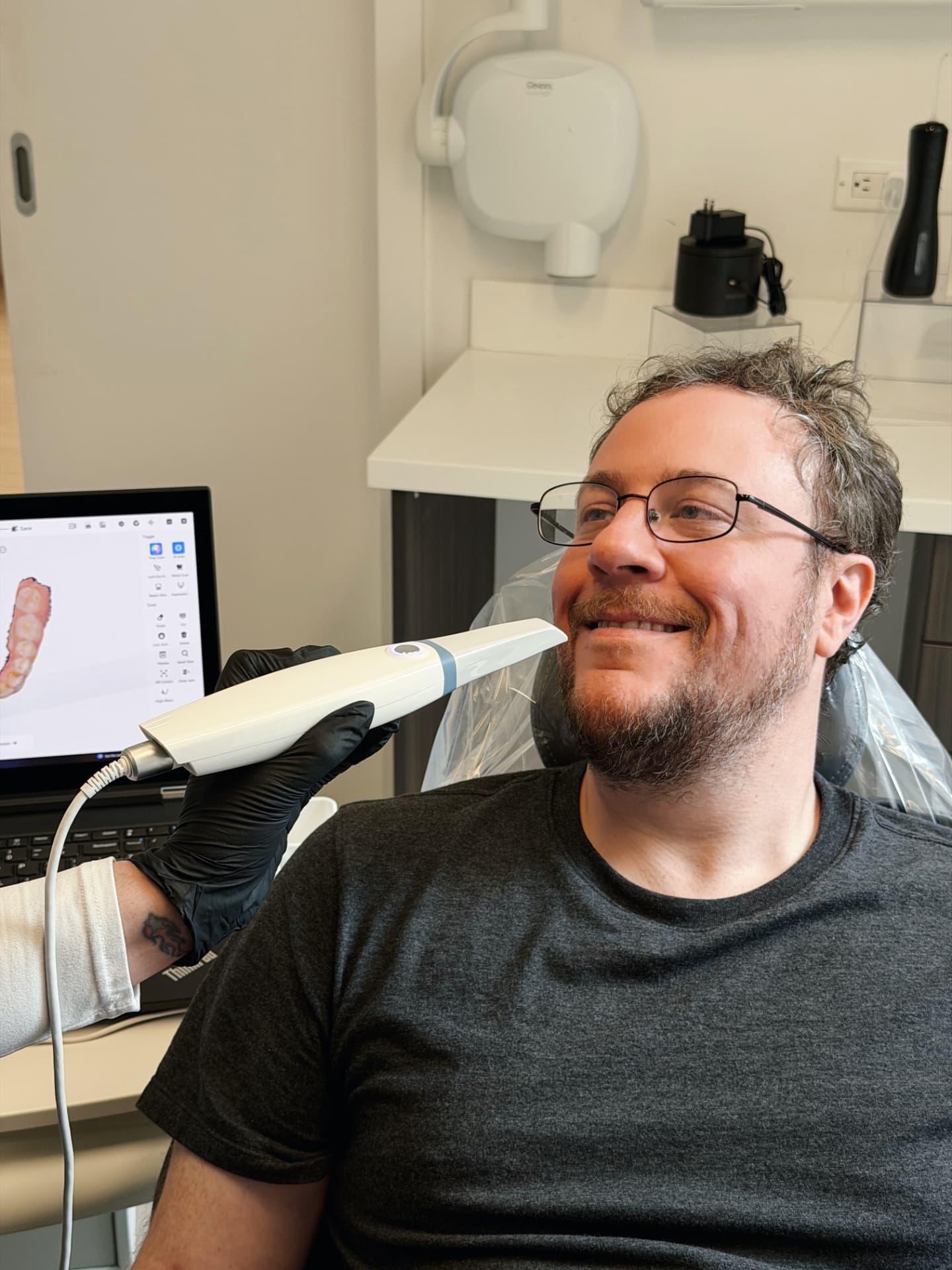 Patient smiling during an in-chair digital smile scan