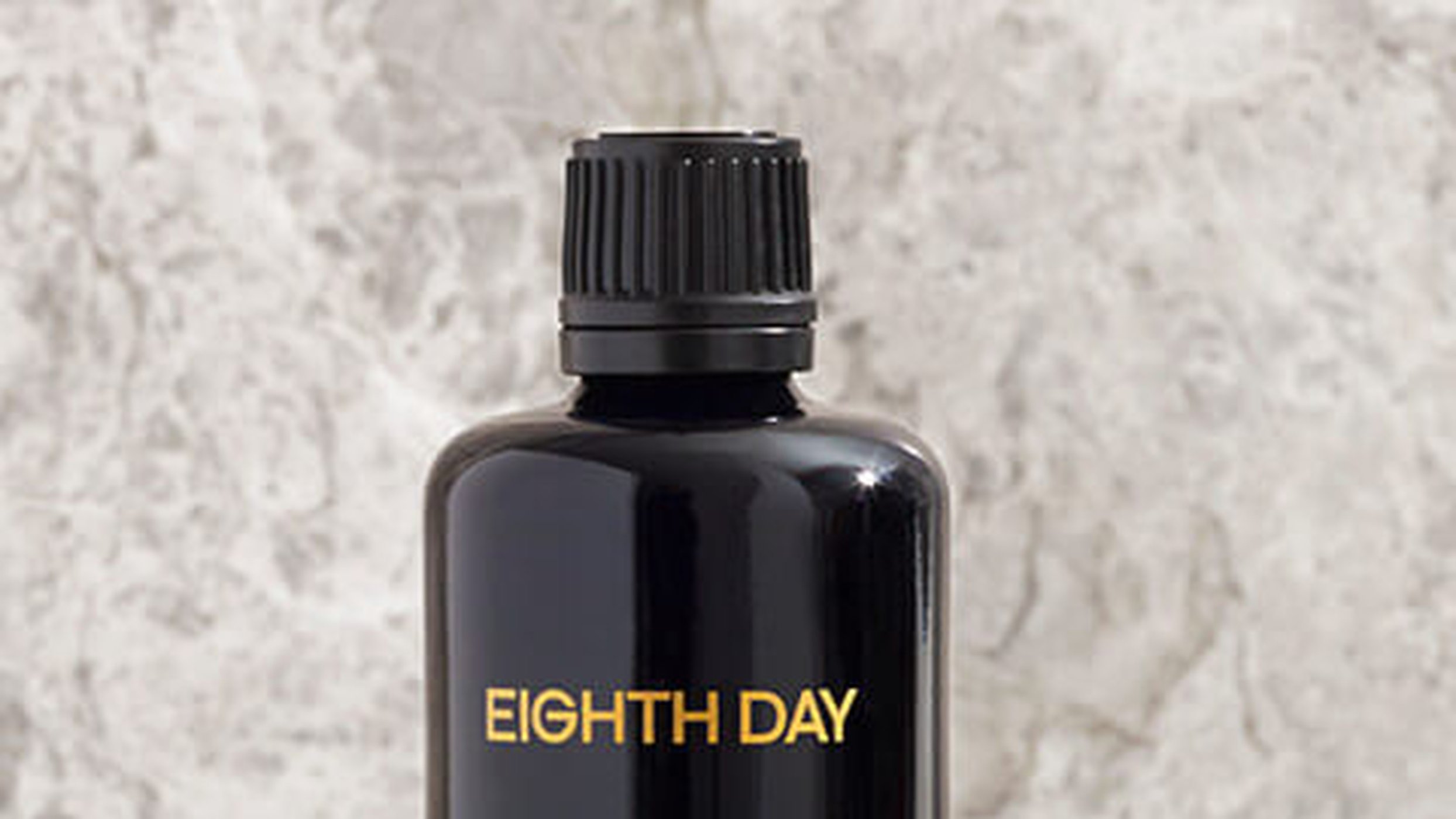 Top of the Eighth Day Resurfacing Tonic bottle on marble