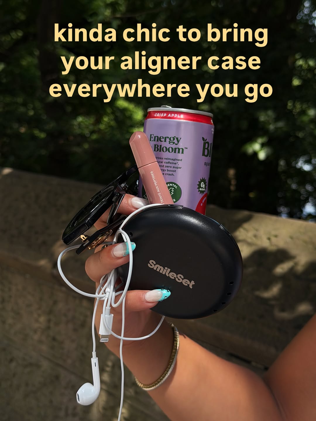 SmileSet aligner case held with everyday essentials