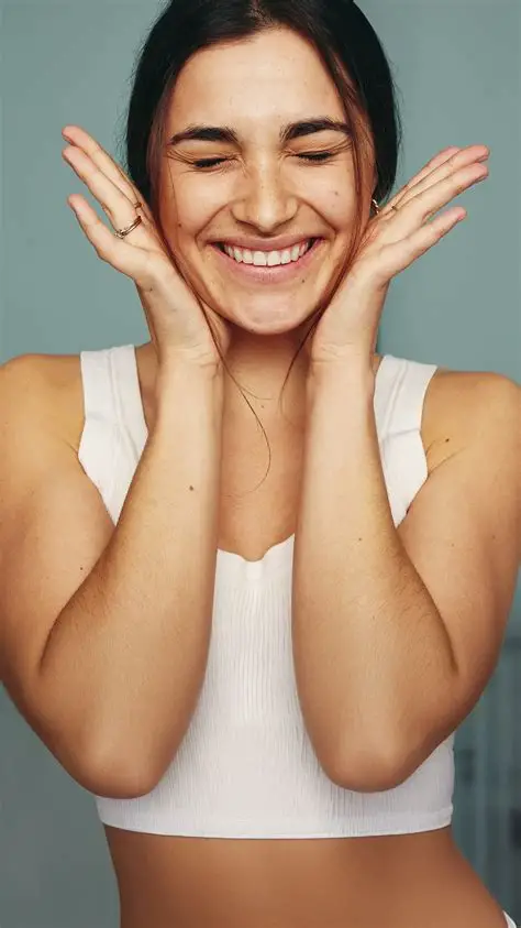 Smiling woman with hands framing her face